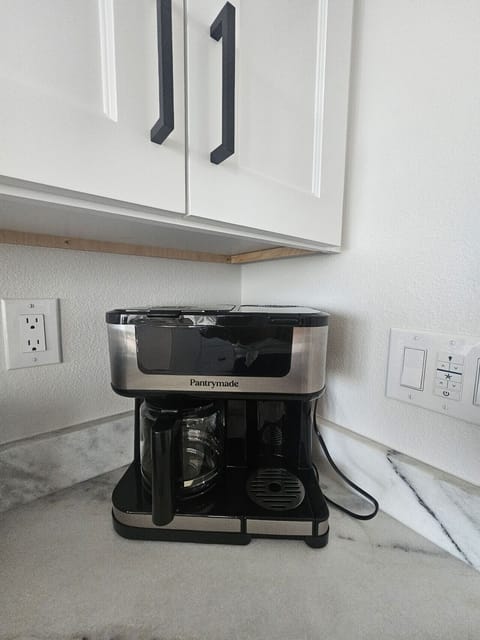 Modern coffee station offering a refreshing start to your stay.