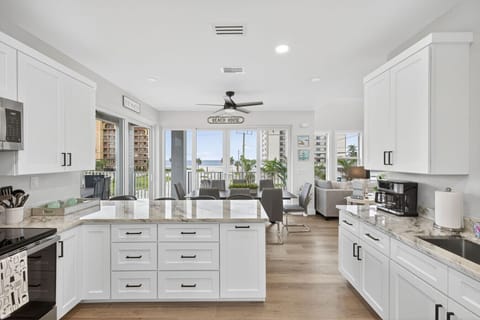 Modern kitchen island offering ample counter space for group dining.