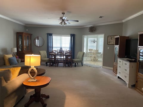 View of the open floor plan from the front door entry. 