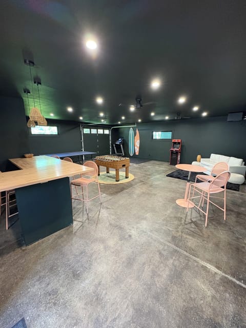 Separate party room with ping pong, foosball and bar area