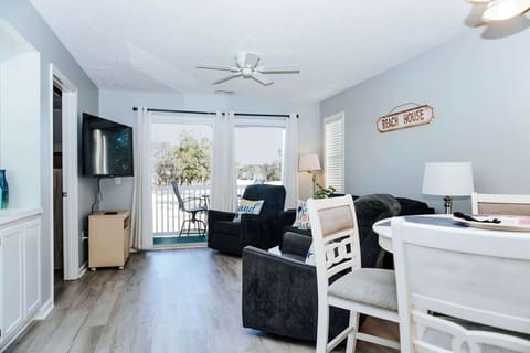 Bright, open living space with screened-in balcony access