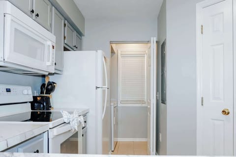 Kitchen with easy access to in-unit washer and dryer
