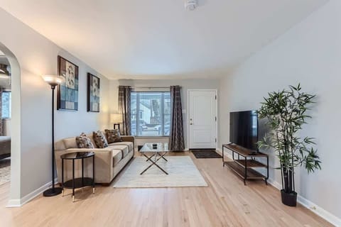 The living room sits directly off the front door, offering a bright and inviting space as soon as you walk in.