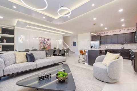 Relax by your private screened-in pool and spa, set on a lush and spacious lawn.