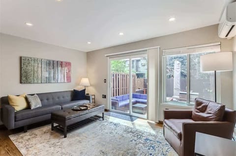 Living room with natural light and direct access to the patio, offering a seamless connection to the outdoors.