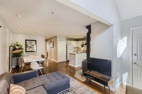 Spacious open-concept area combining the living room, kitchen, and dining space for a comfortable stay.
