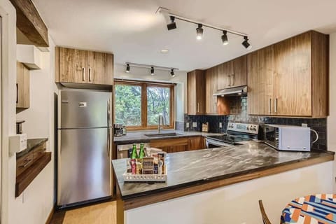 Functional mid-sized kitchen with plenty of counter space, modern appliances, and an open layout for ease of use.