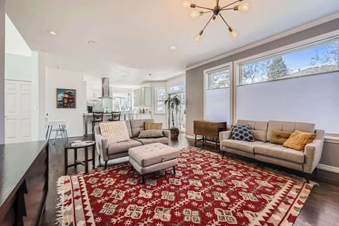 Spacious living area filled with natural light, creating a welcoming and cheerful space to unwind.