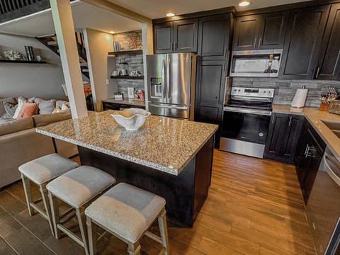 Gorgeous fully equipped kitchen with bar seating!