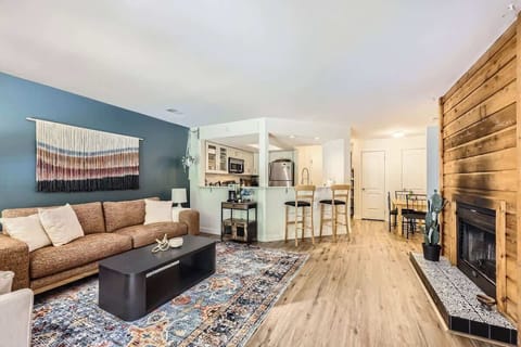 A living room featuring a dedicated coffee station, perfect for relaxing with a morning cup or enjoying a cozy moment with friends and family.