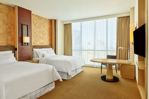 Stretch out together with spacious twin beds and soft daylight.