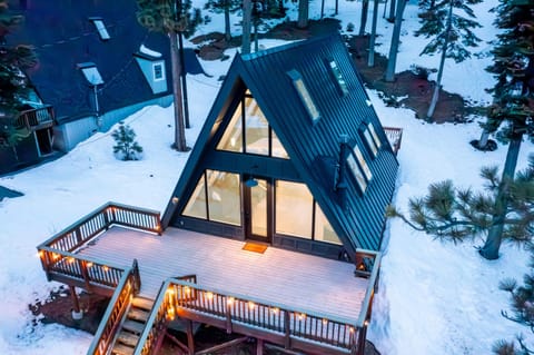 An iconic modern A-Frame with a commanding view of the Lake.