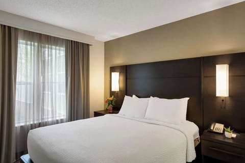 Drift off in a serene bedroom with airy natural light.