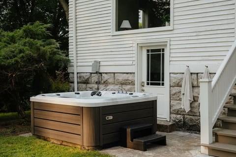 Unwind in the private hot tub while enjoying the peaceful surroundings of the Pearson House.