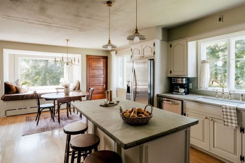 Enjoy your morning coffee in the bright kitchen, complete with a charming breakfast nook by the window.