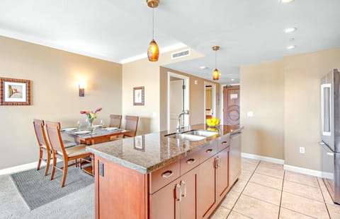 Modern island kitchen with granite counters, perfect for elegant dining moments. HKK-820