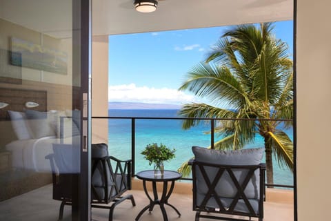 Start your mornings with coffee and an ocean breeze on this private lanai, where paradise is just a glance away    MAH-611