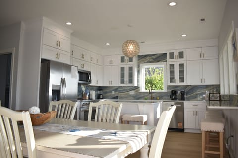 Fully stocked kitchen with 36" convection range with smooth glass cooktop.
