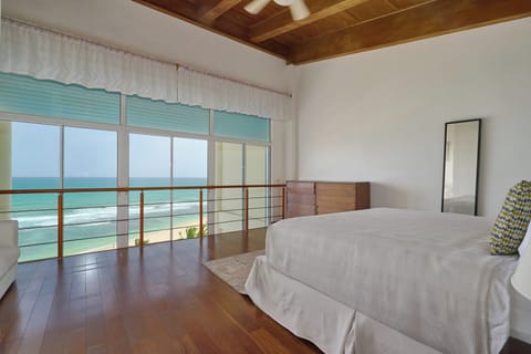 Main room featuring a private balcony with breathtaking ocean views.