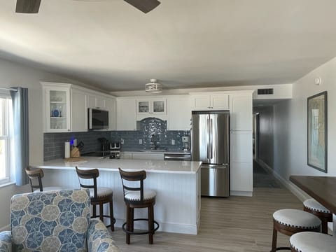 Sit at the bar for a snack or meal or the dining table nearby.