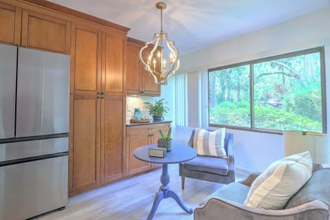 Bright living area with ample seating and TV