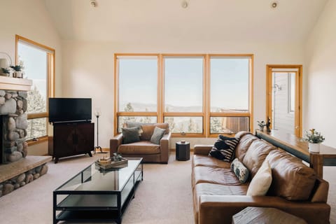 Main level living room with comfy couches and a grand view