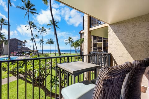 Your private balcony overlooks swaying palms, lush gardens, and sparkling ocean views—perfect for morning coffee or sunset cocktails in paradise.