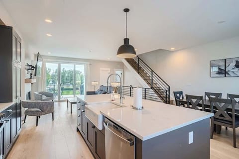 Seamless flow between living, dining, and kitchen areas in the townhome on the second floor 