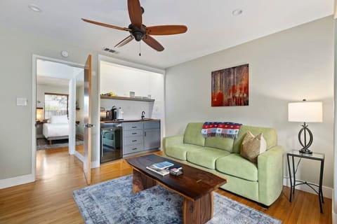 Spacious open-concept living area with hardwood floors