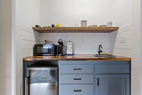 Kitchenette with Nespresso, microwave, and fridge