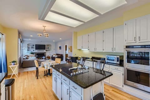 Kitchen Equipped with Oven, Stove, Microwave, and More