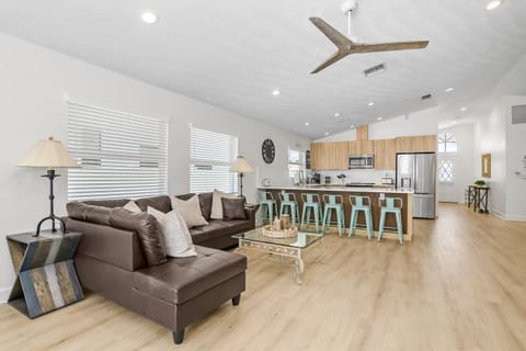 Whether you’re cooking up a meal or unwinding on the sofa, this open layout lets everyone stay connected and enjoy time together