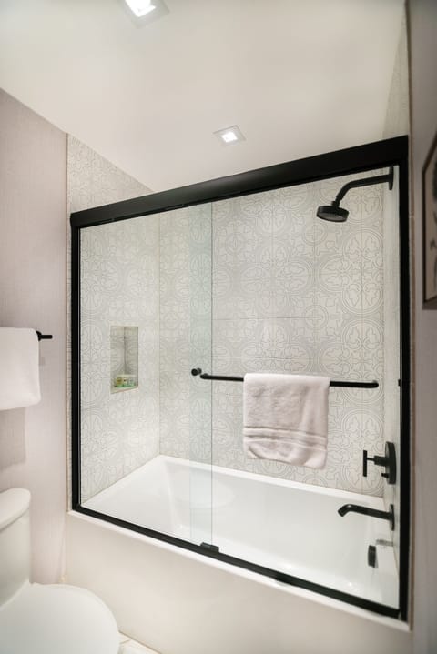 Relax on the sofa with morning light and warm finishes.