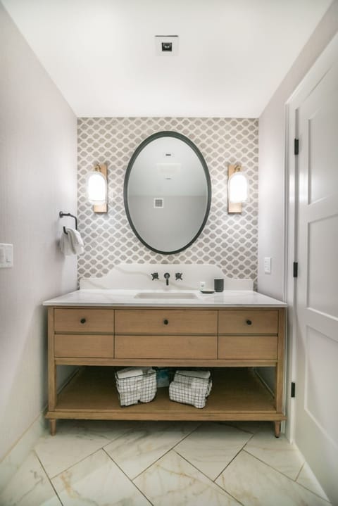 Start your day at a bright vanity with stylish lighting.