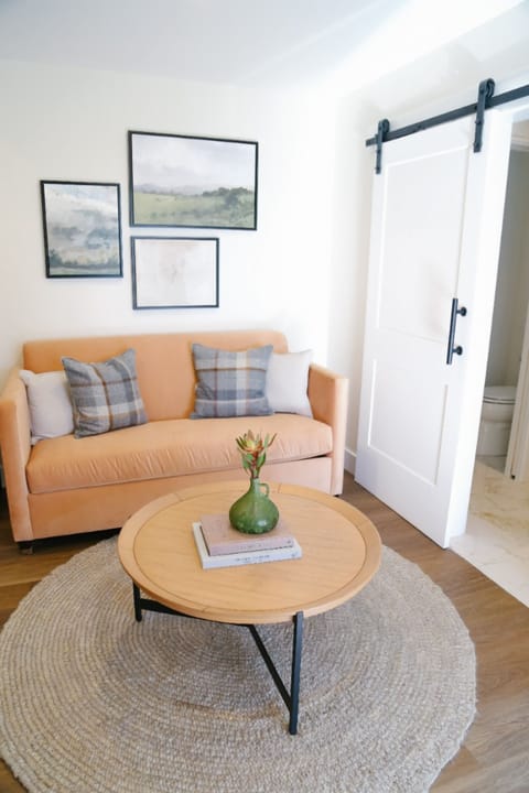 Kick back on the plush sofa with coffee and soft light.