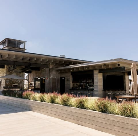 Sip and savor in a stylish open-air bar setting.