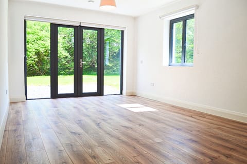 Lough Conn Haven Holiday Home. Bright modern spare room wooden floors.