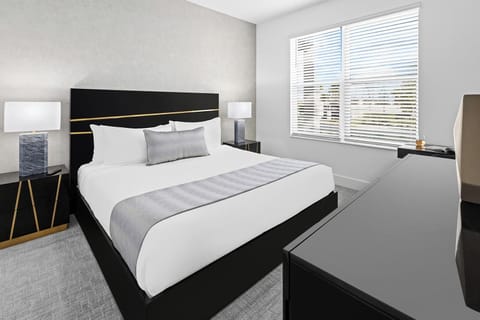 Recharge in a sleek retreat with soft light and calm tones.