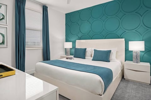 Recharge in a serene room with crisp linens and teal décor.