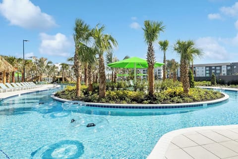 Float effortlessly along the lazy river under swaying palms.