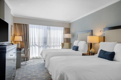 Wake up to bright daylight streaming across plush beds.