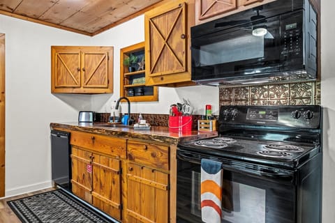 Rustic wood cabinetry + modern conveniences = the best of both worlds.