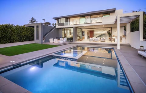 Modern luxury meets resort-style comfort in this stunning backyard oasis