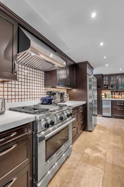Whip up family favorites or new recipes in a beautifully designed kitchen stocked with all the essentials,  from cookware to cutlery and high-end appliances for convenience.