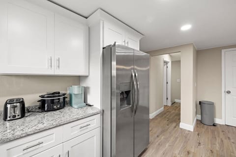 Make yourself at home in this bright kitchen, stocked with modern amenities for a hassle-free stay.