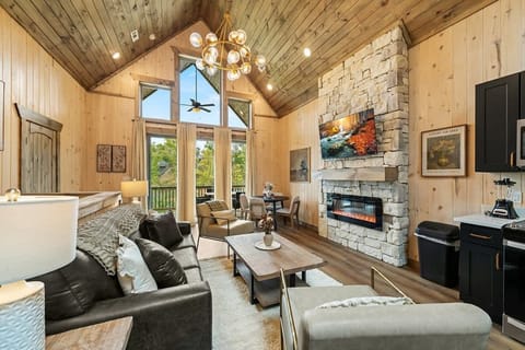 Open main level floor plan with living, dining, and kitchen.