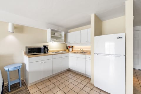 The full kitchen has everything you need for your stay (no oven)