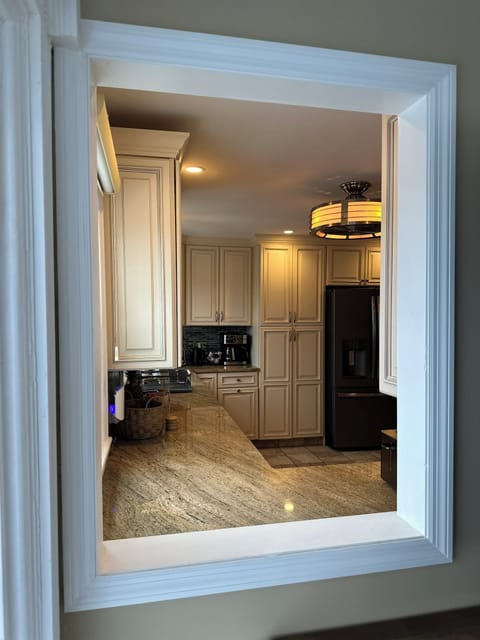 View into kitchen from living room. 