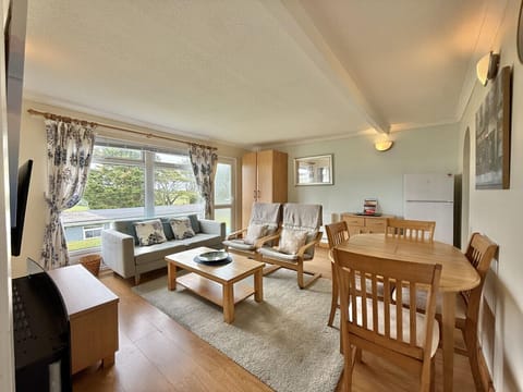 Open plan living, dining space with wardrobe and rural countryside views
