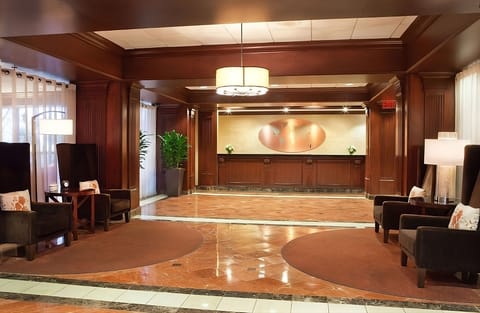 Unwind in a warm, polished lobby with inviting seating.